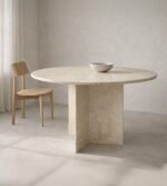 Yuvarlak Traverten Yemek Masası minimal bir odada duruyor